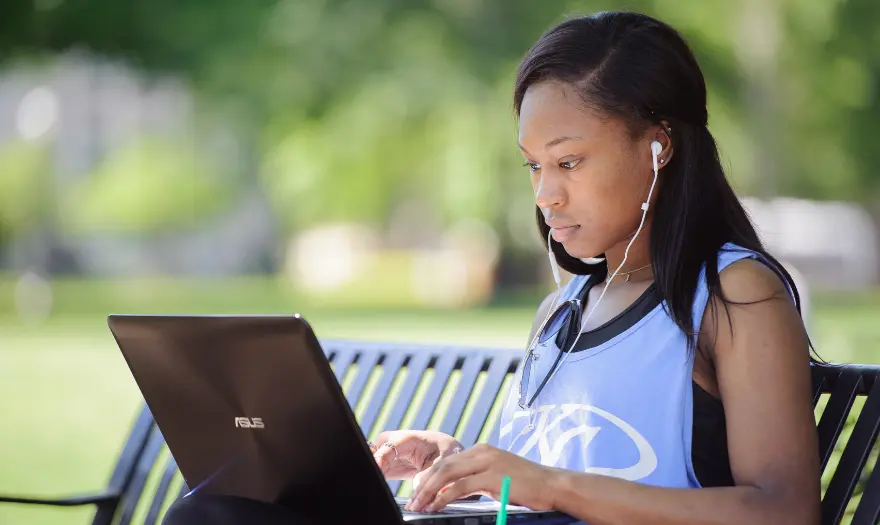 girl with laptop and headphones in